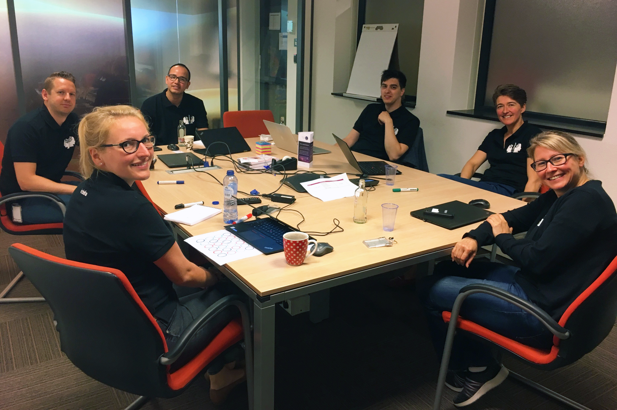 Irdeto team gathered in Hoofddorp office during a cybersecurity hackathon.